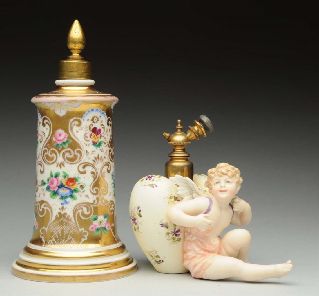 Lot of 2: Perfume Bottles.: One is mark "KPM" Hand painted floral decor, Second one is a cherub porcelain with atomizer. Condition (Excellent). Size 7" T.