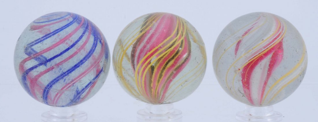 Lot of 3: Large Swirl Marbles.: Lot includes a three stage solid core, a multicolor divided core and a white latticino swirl. Condition (8.8-8.9). Size 1 - 17/32" Dia.