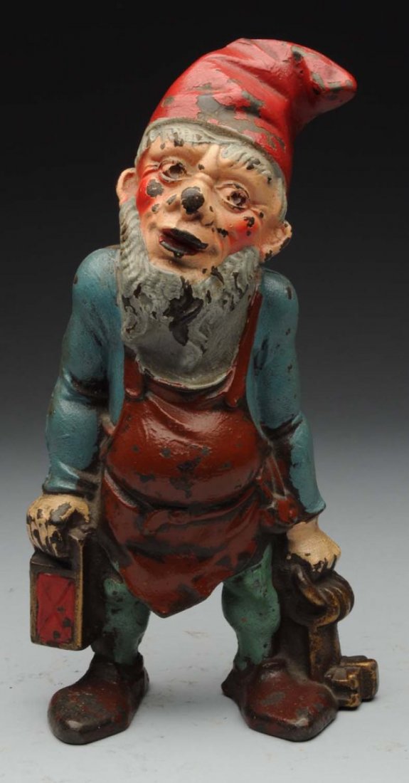 Cast Iron Gnome with Lantern and Keys Doorstop.: Full-figure. “Pat. Pending” on back of hat. Condition (Very Good). Size 10" T.
