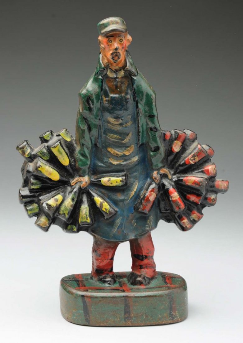 Cast Iron Wine Merchant Doorstop.: Shows Wine Man wearing apron and holding bottles of red wine in left hand and white wine in right hand. Well executed casting, full-figure, solid casting. Rare and Desirable. Condition (Excellent). Si