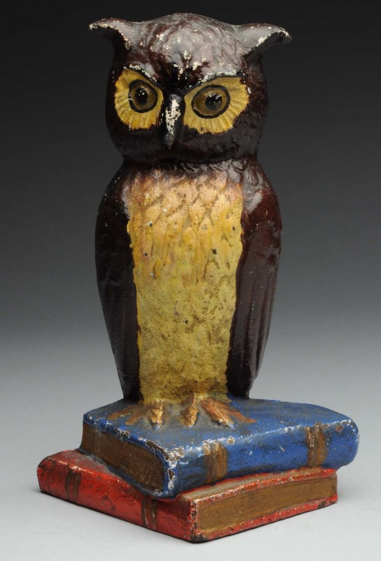 Cast Iron Owl on Books Doorstop.: Signed, “ Eastern Specialty Co.” Superb example of this doorstop, owl perched on two books. Condition (Excellent Plus). Size 9 - 1/2" T.