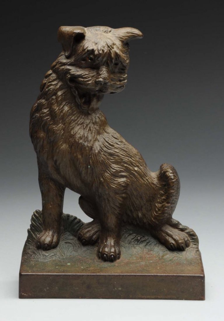 Cast Iron Cairn Terrier Dog Doorstop.: Bradley and Hubbard. Marked, “B&H”. Very fine detail to casting. Condition (Very Good). Size 9" T.