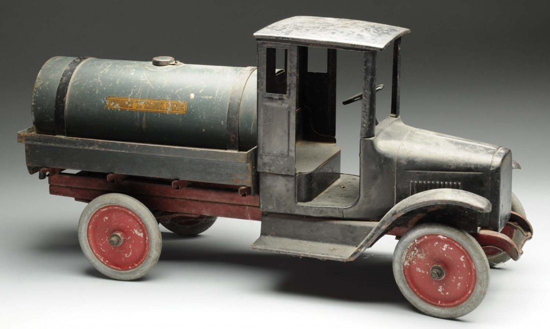 Pressed Steel Buddy L. Tank Line Truck.: All original including decals, has spout on back. Missing tin cans. Has tank cap on rear. Some oxidation to fenders and roof, fairly complete decal in front of seat. Very good condition but might clea