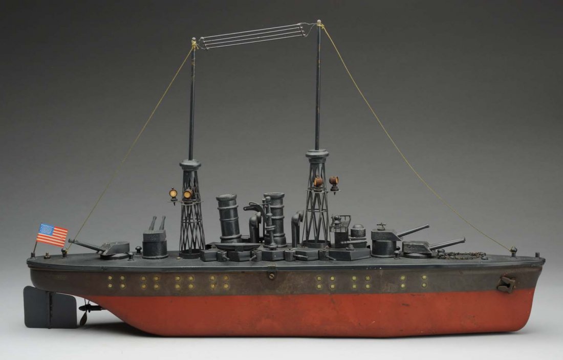 Orkin New Mexico Dreadnought Battle Ship.: American made clockwork toy. The hull looks to be original, but does have some fading and water staining. The top deck looks to be professionally restored. Combination of steel and wood. Nice elaborat