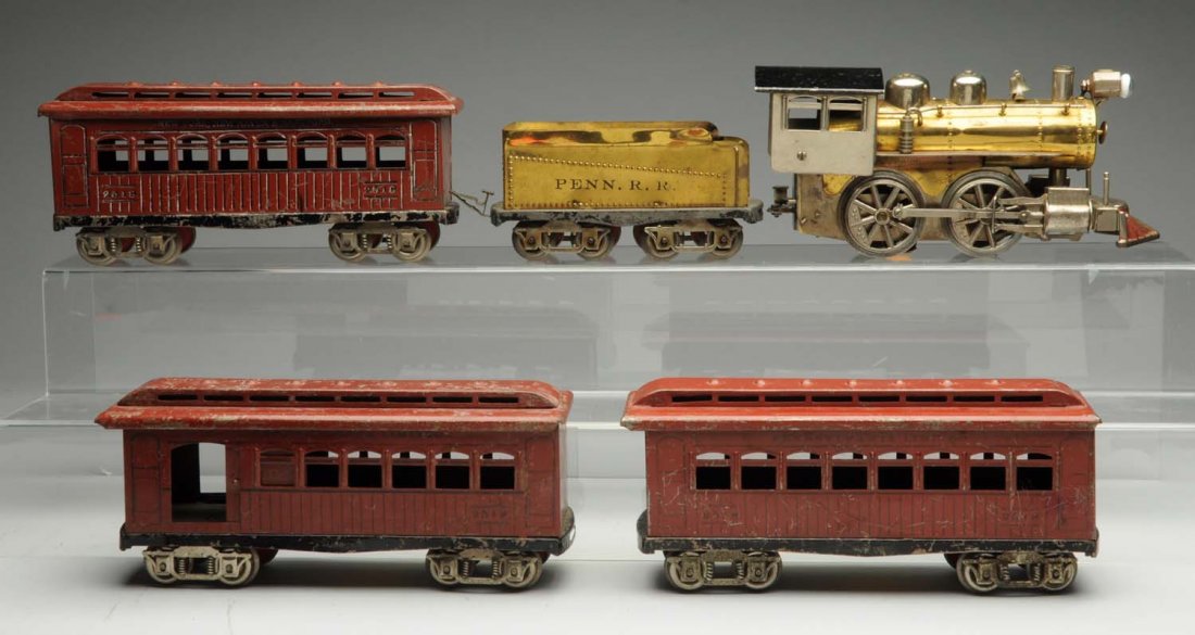 5pc. Elektoy Passenger Set.: Lot includes one brass steam locomotive with a black painted roof. Is complete and all original. Very clean and attractive. One tender marked PENN. R.R. is complete and all original. Does have some pa