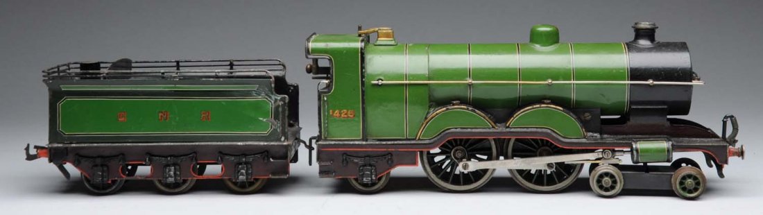 Basset Lowe Pre-War 1 Gauge Engine & Tender.: European English-style steam-type engine. Marked "1425" on side. Clockwork with matching GNR six wheel tender. Some paint loss on one side of tender, and some rubbing to the top of the engine. Conditi