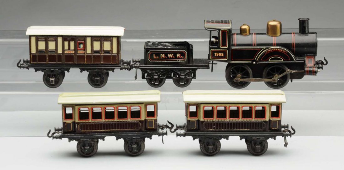 Bing 1 Gauge King Edward VII Passenger Train Set.: German. Includes original box with beautiful color label of train in station. Box is missing all four side aprons, with some creasing and paper loss. Train includes an English European-style No. 1902 