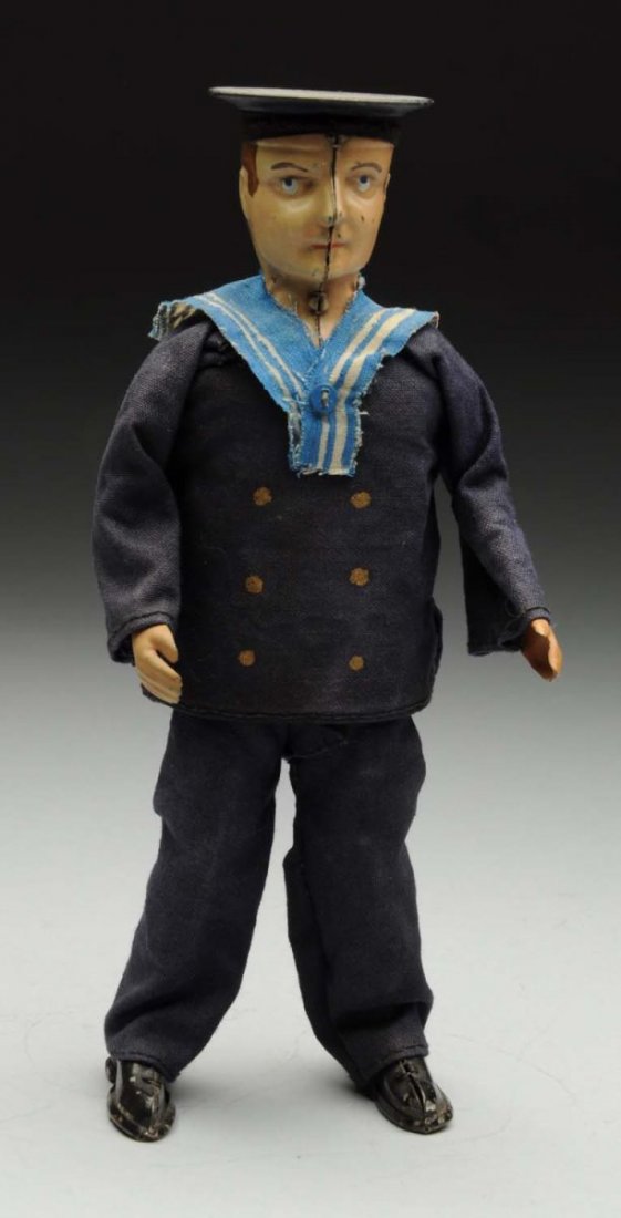 Lehmann Tin Litho Wind-Up Sailor Toy.: German. Toy has original clothing but is missing the tassel on its hat. Some minor paint loss and chipping. Condition (Very Good). Size 19" T.