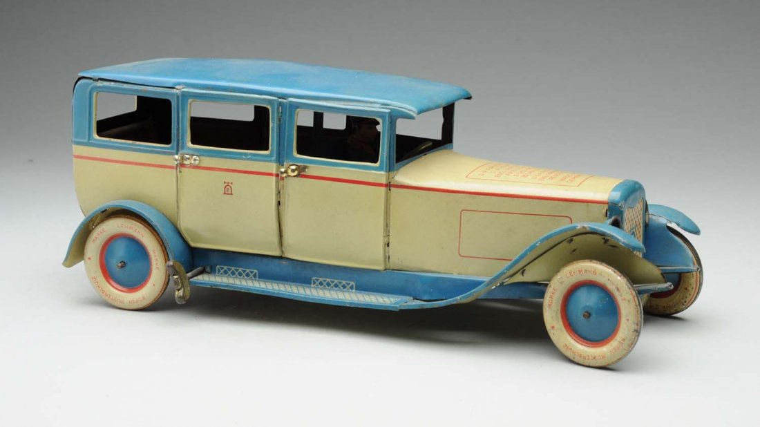 German Lehmann Gala Tin Litho Wind-up Auto Toy.: Original lithograph driver. Marked "Lehmann" and bell mark on rear, "780" on front license plate below grille. Original rear opening doors. Some minor scratching to roof. Condition (Very Good - Excell