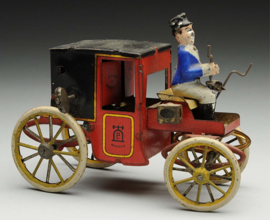 Lehmann Tin Litho Wind-Up Auto Coach Toy.: German. Marked "Made in Germany". Depicts driver in front holding tiller. Original lamps have some oxidation, and there is general wear to figure and wheels. Condition (Very Good - Excellent). Size 5