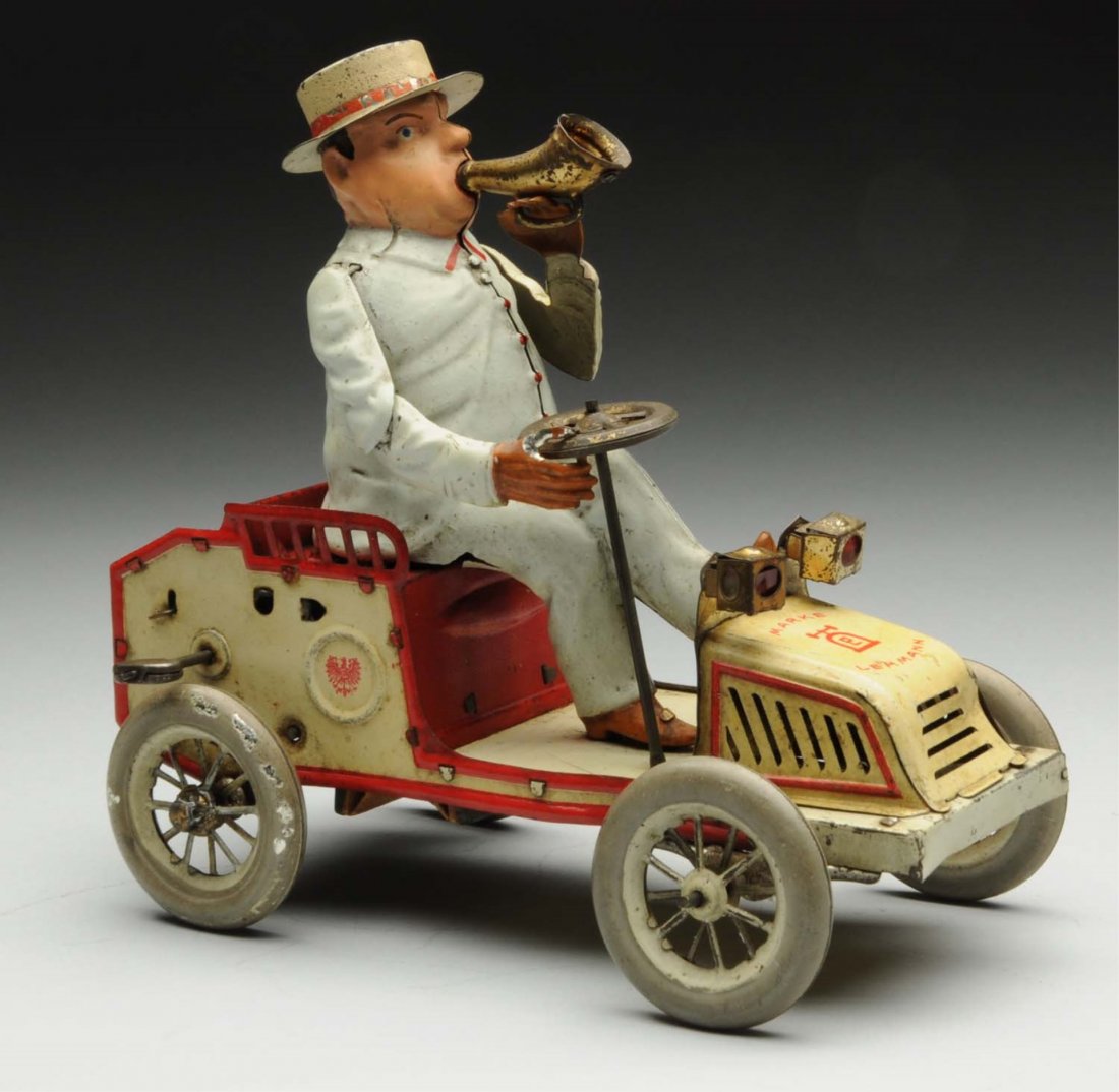 Lehmann Tin Litho Wind-Up Tut Tut Toy.: German. All original, including front headlights. Does not work, and needs a good cleaning. Some litho loss, especially to wheels, and oxidation to bare metal parts. Condition (Very Good). Size 7" L.