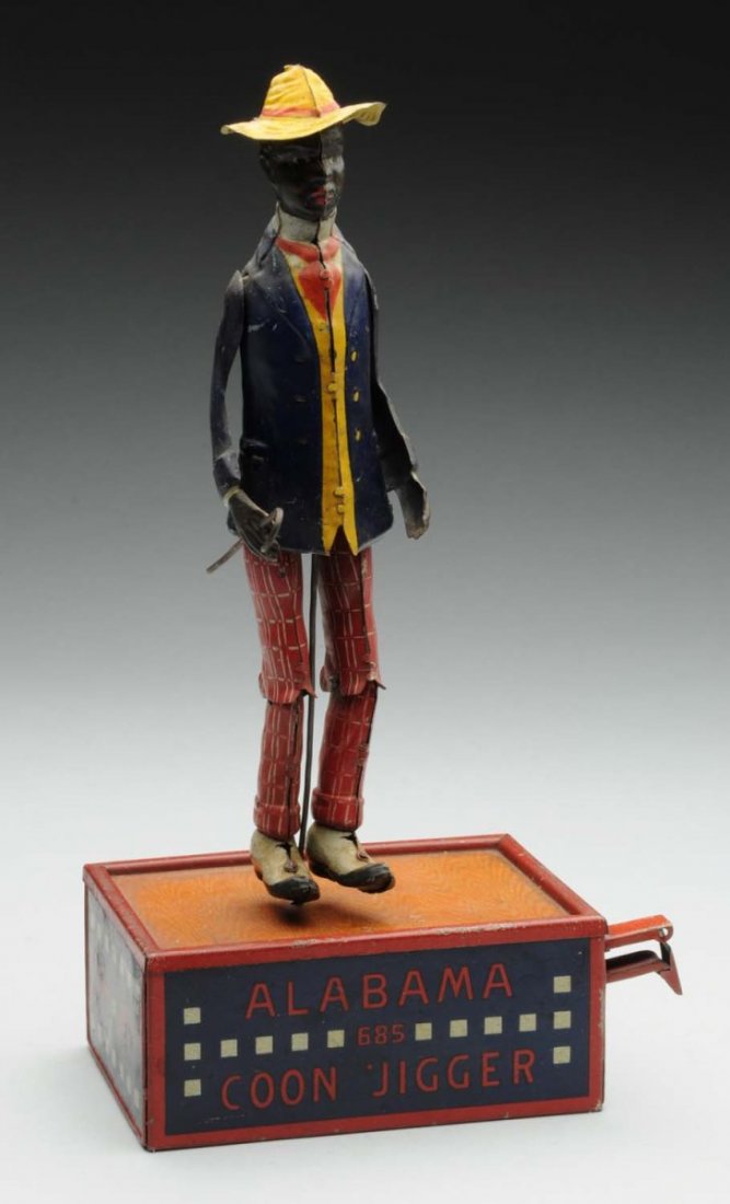 German Lehmann Tin Litho Alabama Jigger Toy.: Depicts African American man holding cane and dancing on a roof. Some general overall wear to the base, and some scratching to the figure underneath the arms. Condition (Very Good). Size 10 - 3/4" T.