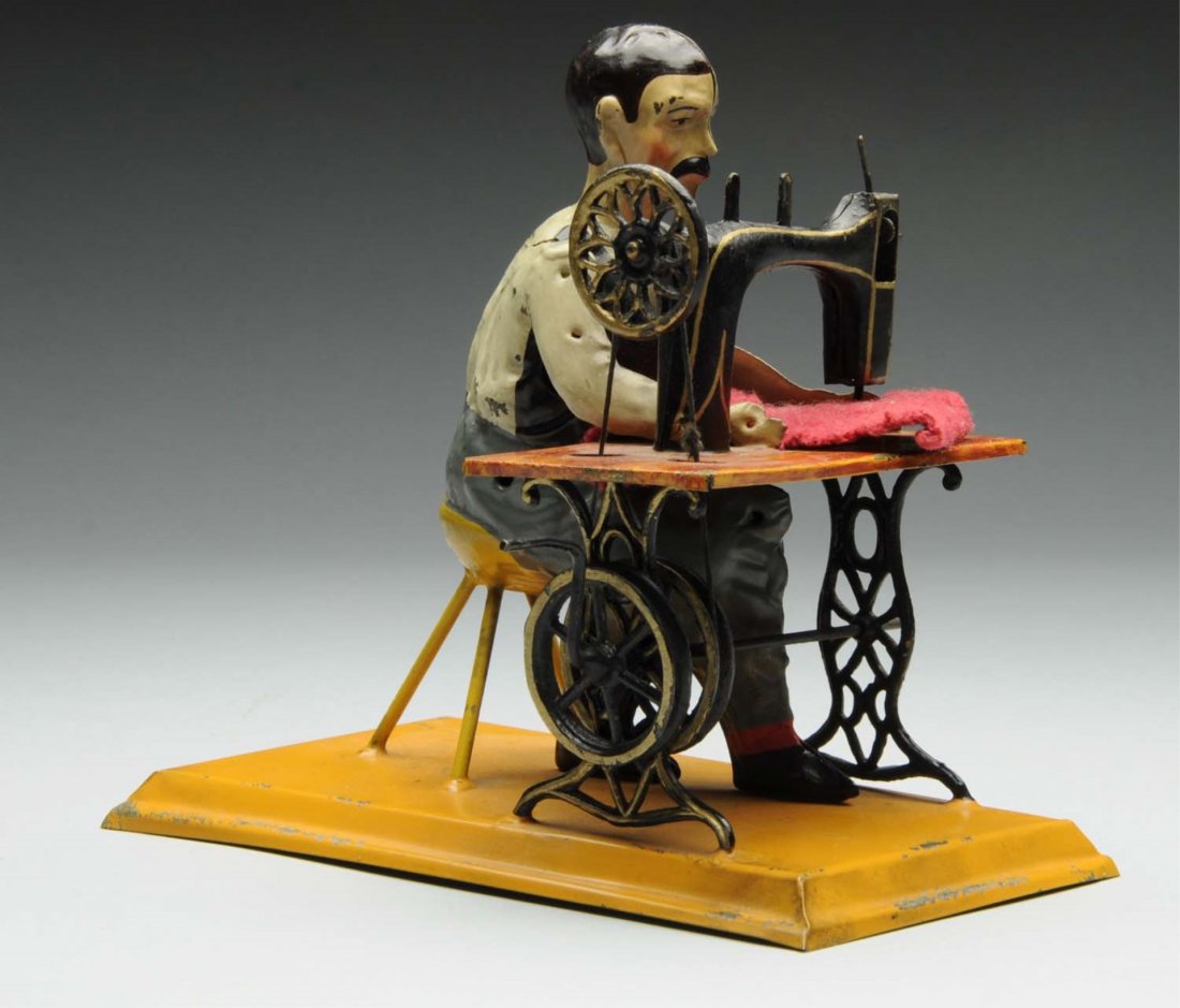 German Hand Painted Carette Tin Toy Sewer.: Very little wear. Great color. Condition (very Good). Size 6 1/4" L.