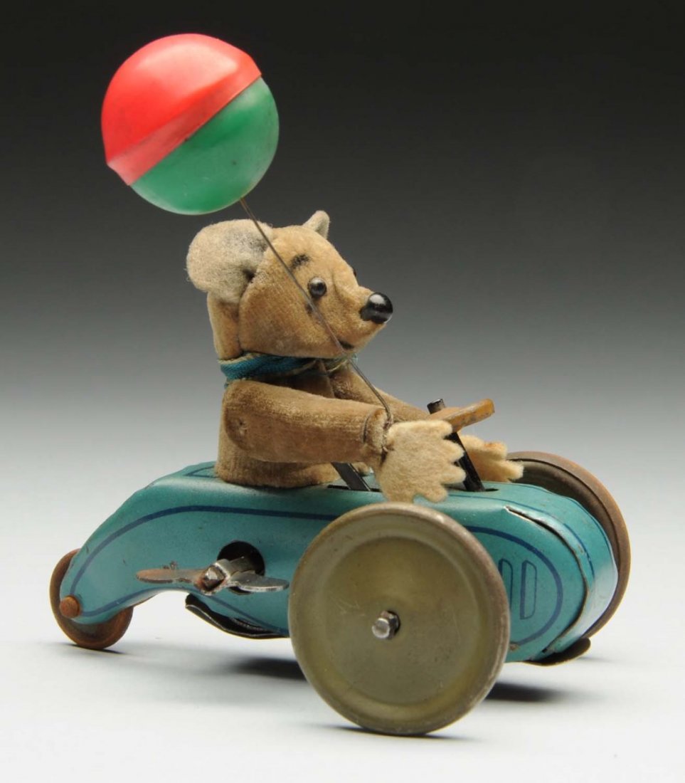 Schuco Tin Litho Wind-Up Mouse & Balloon Toy.: German. Pre-war. Marked "Made in Germany" on sides. Mouse is all original and has some soiling and fading. When in operation right hand goes up and down with celluloid balloon in hand. Condition (Very