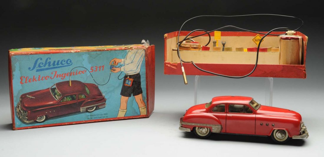 Boxed Schuco 5311 Car.: Includes nice original box. Car made in Germany, movement of car made in Switzerland, and marked "Radio 5311" on bottom. Toy has original windshield. There is edge wear to the box, but very little wea