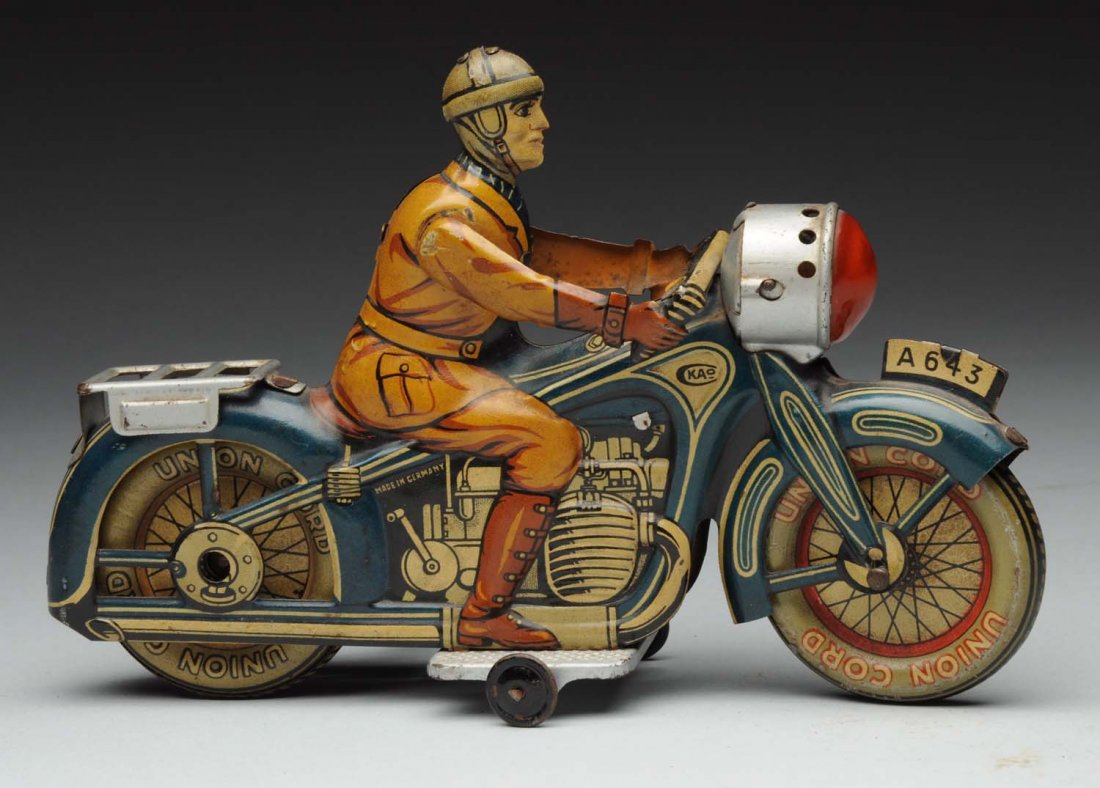 German Pre - War Sko Civilian Rider Motorcycle.: This toy is the scarce blue variation. Has original headlight, marked "Made in Germany" and "Ckao" on both sides of gas tank. Also marked "A643" on both sides of front fender. Tin litho wheels marked 