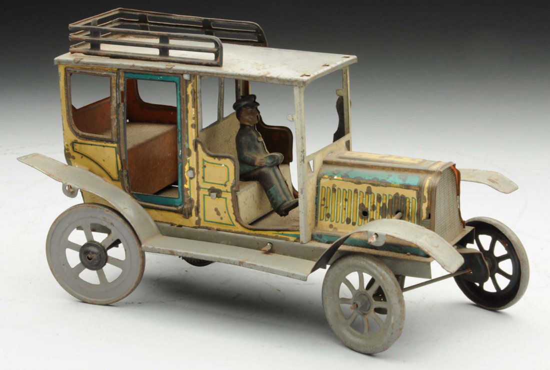 German Tin Litho Wind-Up Automobile Toy.: Unmarked, but probably Hans Eberle. Car includes original driver. Missing back doors. There is some scratching, litho loss, and wear throughout. Condition (Very Good). Size 8" L.