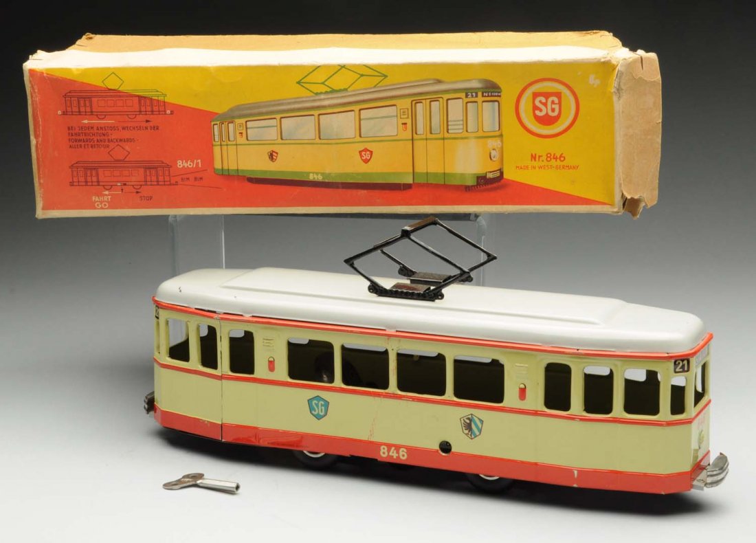 German Tin Litho Wind-Up Trolley Toy.: Manufactured by Sam Guntherman. Includes very colorful original box marked "Made in West Germany." Original trolley antenna on top marked "846." Trolley also marked "Made in Western Germany." Very lit