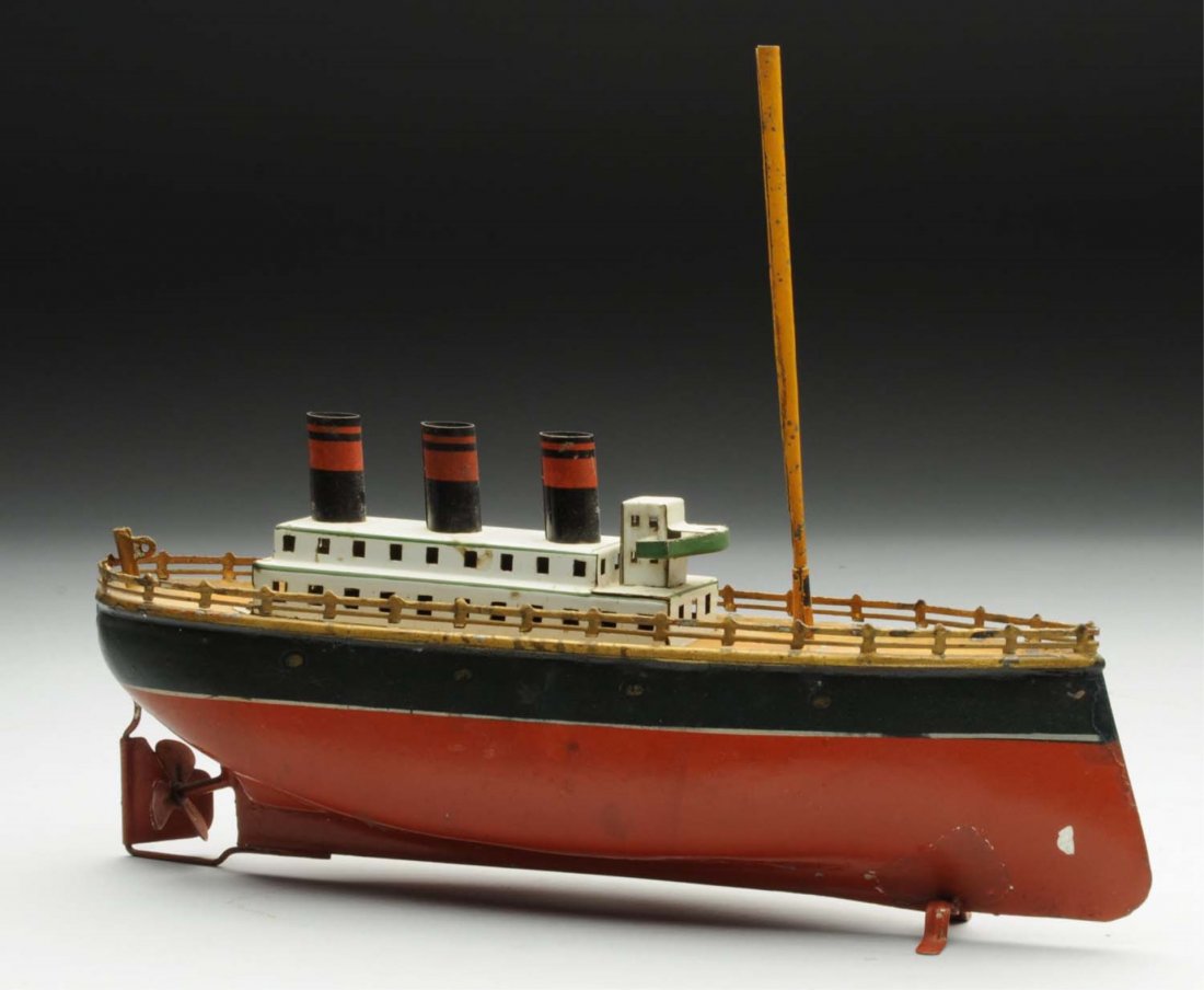German Bing Clockwork Ocean Liner Boat.: Original mast. Missing flags. Some paint touch up to the hull, and some paint chips showing bare metal. Condition (Very Good). Size 10" L.