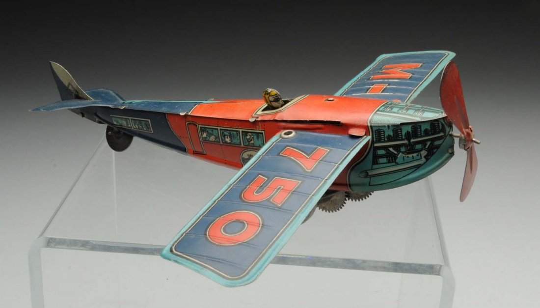 Early Ingap Tin Wind-Up Airplane.: Circa 1930s, Ingap, Italy; delicate, all tin pre-war plane has dimensional pilot and fold-back wings, lithography says "M-750" on top of wings, and shows engine details and passengers on sides; pilot 