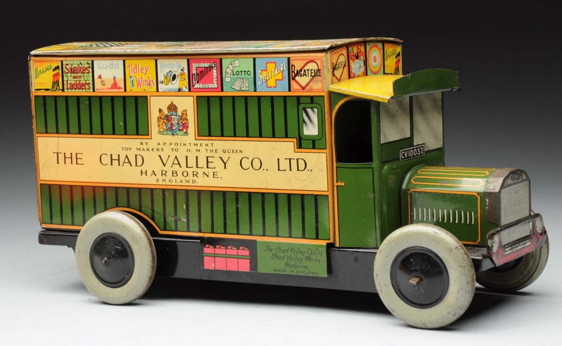 English Chad Valley Tin Litho Wind-Up Biscuit Van: Marked " The Chad Valley Co. LTD" on sides and "Made in England". Beautiful lithography on top. Original back door; which is difficult to find. Some moderate scratching and edge wear. Condition (Very 