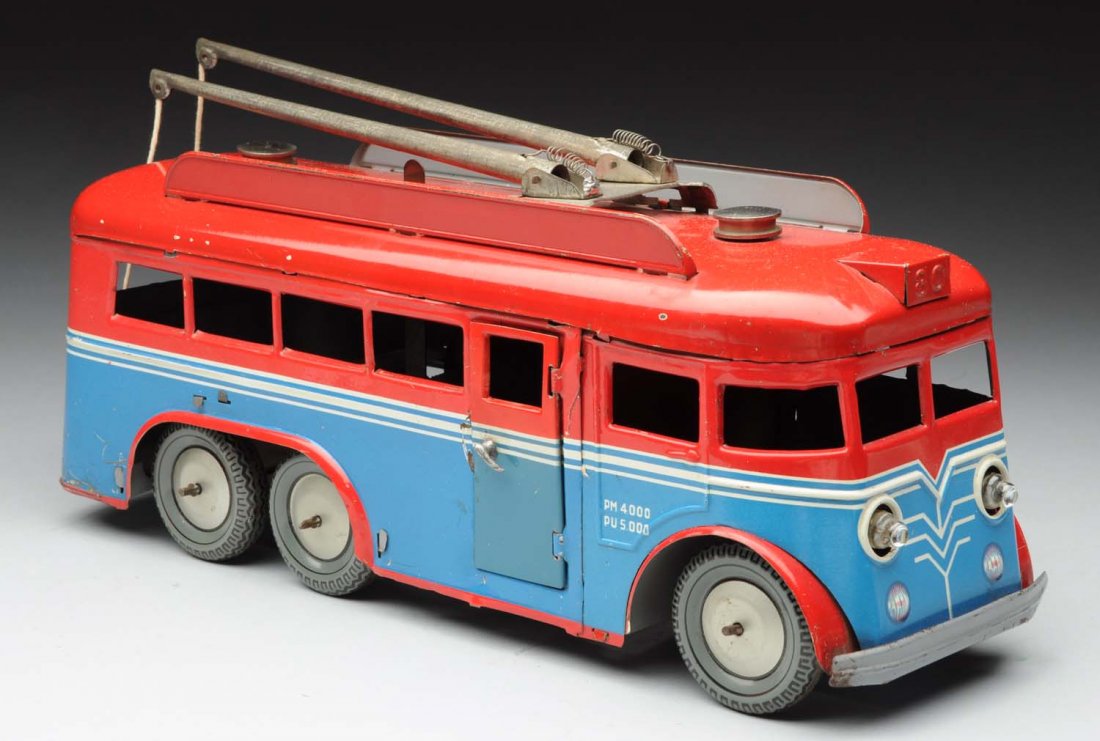 French Tin Litho Wind - Up Trolley Bus.: Original pulls. Electric headlights, opening doors. Some oxidation to bare metal parts and some edge wear. Condition (Excellent). Size 11" L.