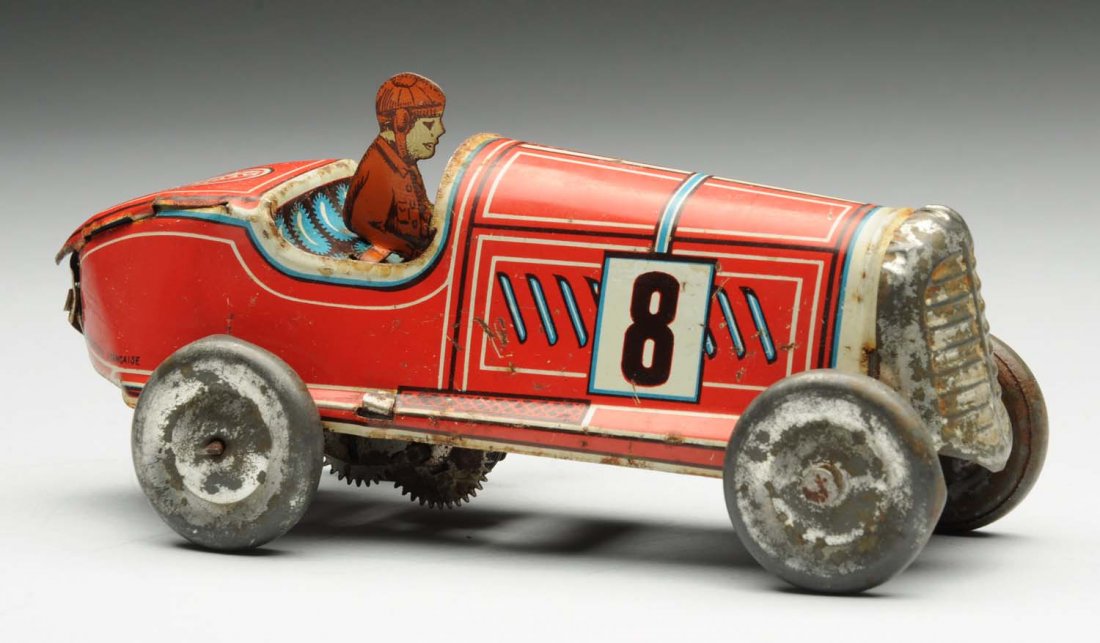 French Tin Litho Wind-Up Race Car.: Marked "No. 8" on both sides of hood, "Memo" on back and, "Fabrication Francaise" on side. Oxidation to all bare metal parts. Some scratching. Condition (Very Good ). Size 6" L.