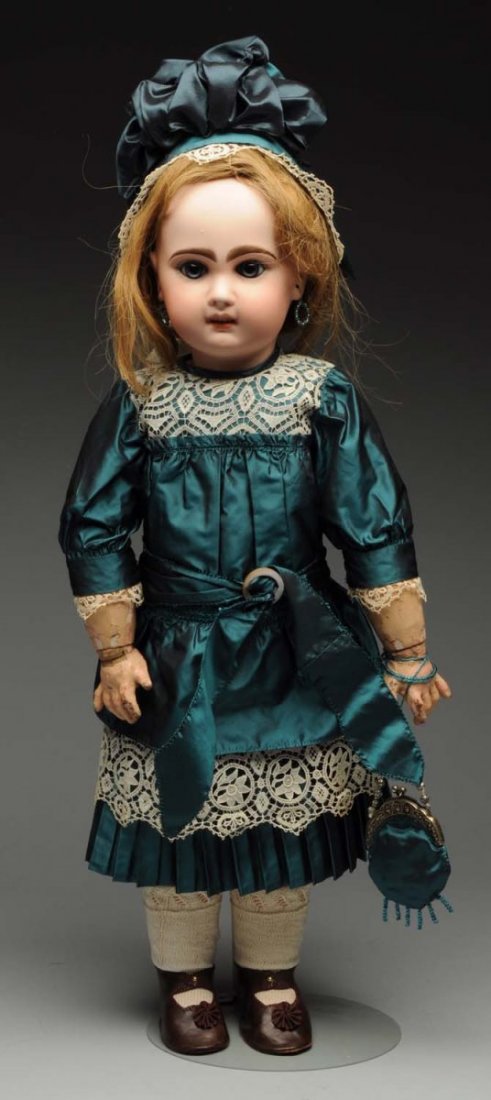 Classic Jumeau Bébé Doll.: French bisque socket head with Jumeau checkmarks (side back of head professionally repaired not affecting the facial features, lots of wig pulls, flake on upper left eye), multistroked eyebrows, paper