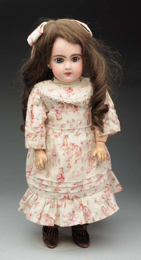 Classic Jumeau Bébé Doll.: French bisque socket head incised X 7 with simple Tête Jumeau red stamp (light surface line on forehead), multistroked eyebrows, painted upper and lower lashes, blue paperweight eyes, open mouth with