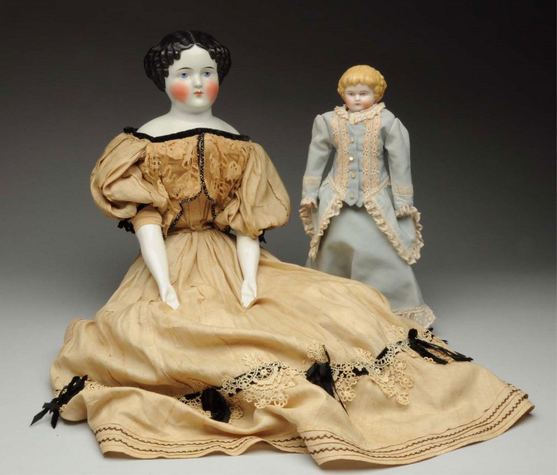 Lot of 2: German Antique Dolls.: Highland Mary 1880s-type bisque head with molded blonde hair possibly by Alt, Beck & Gottschalck, dainty painted features, sturdy kid body with bisque lower hands (chip on hand), redressed in blue gow