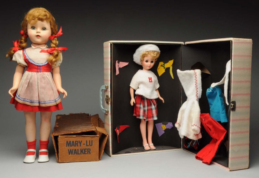Lot of 2: Dolls.: Hard plastic walking doll with blonde braids in original red dress; Mary Lu Walker box only; vinyl fashion doll in original wardrobe box with extra clothing pieces. Nice to find ensemble dolls! Condit