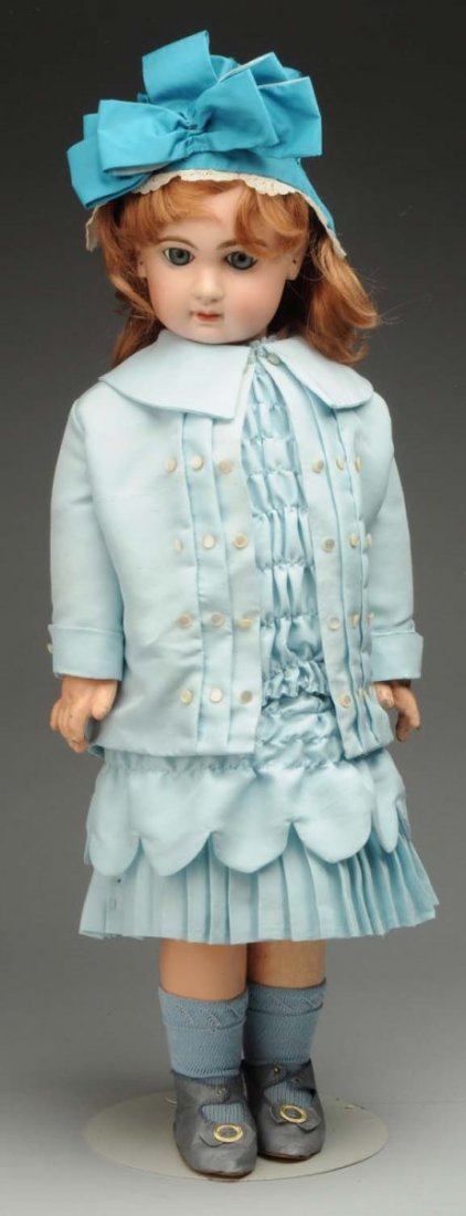 Lovely Jumeau Bébé Doll.: French bisque head with Tête Jumeau red stamp and Jumeau check marks (head broken in many pieces and professionally repaired), replaced paperweight eyes, closed mouth, pierced ears, replaced wig; ori