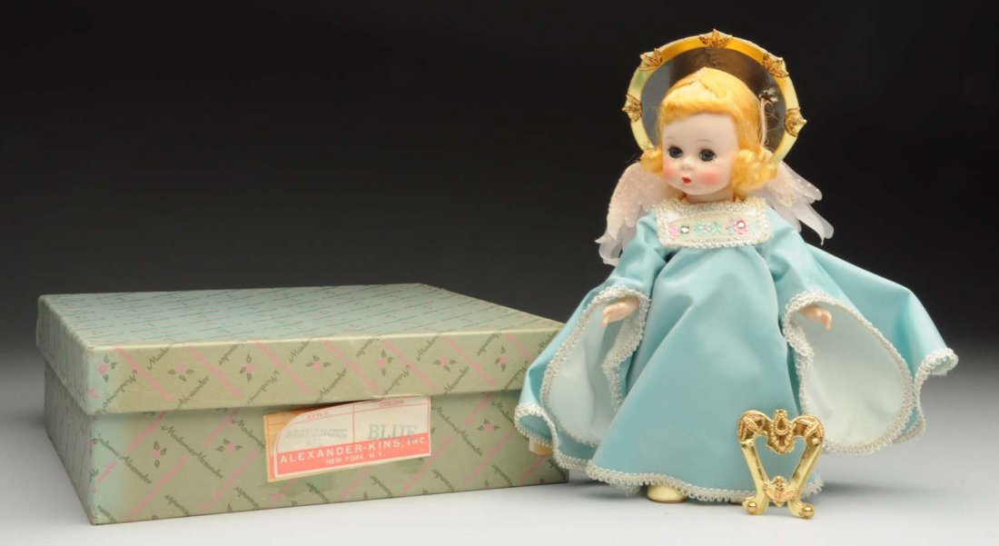 Madame Alexander Hard Plastic Doll.: Tagged “Guardian Angel” straight leg walker, all factory original and crisp with her gold harp. Box label “Baby Angel 480”. Condition (Excellent). Size 8" T.