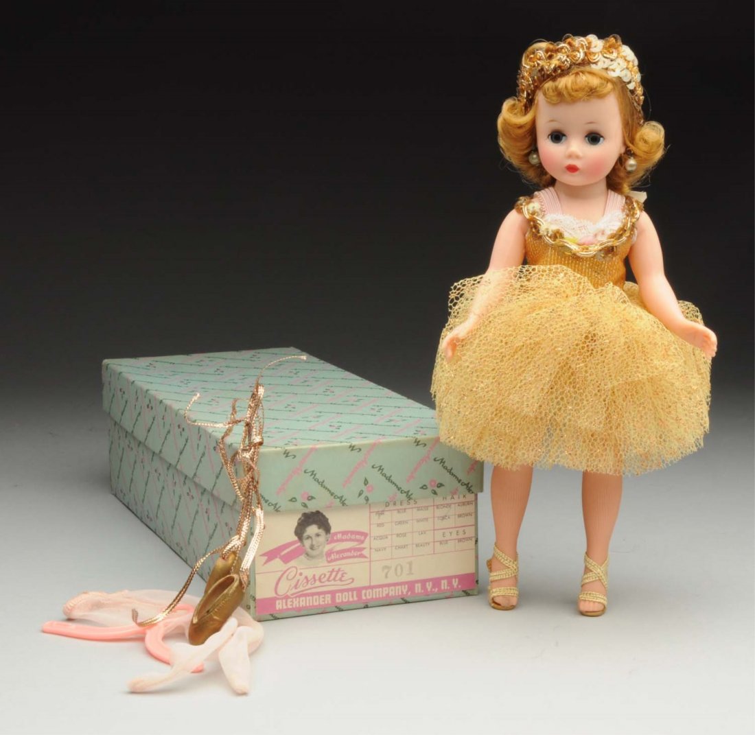 Madame Alexander “Cissette.”: Hard plastic doll with factory original gold ballerina outfit with both gold heels and gold ballet slippers and stockings, original box with “Cissette 701” label. Stunning! Condition (Excellent). 