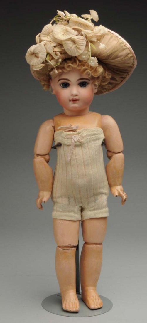 Beautiful E.J. Jumeau Bébé.: French bisque socket head incised “Depose E 7 J” with Jumeau checkmarks (head broken in lots of pieces, professionally repaired and repainted), blown glass eyes, closed mouth, pierced ears, antiqu