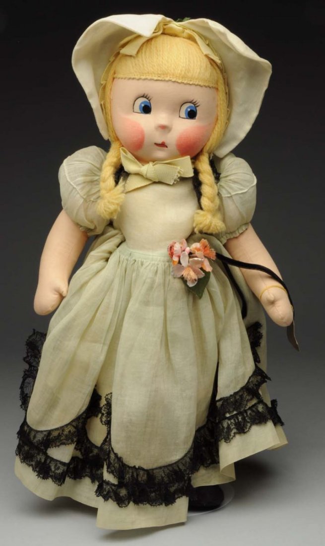 Alexander Cloth Doll.: All cloth with mask face featuring large side-glancing eyes, yarn hair, original tagged organdy outfit with lace trim with original wrist tag. Possibly she is “Kate Greenaway.” Very rare and desir