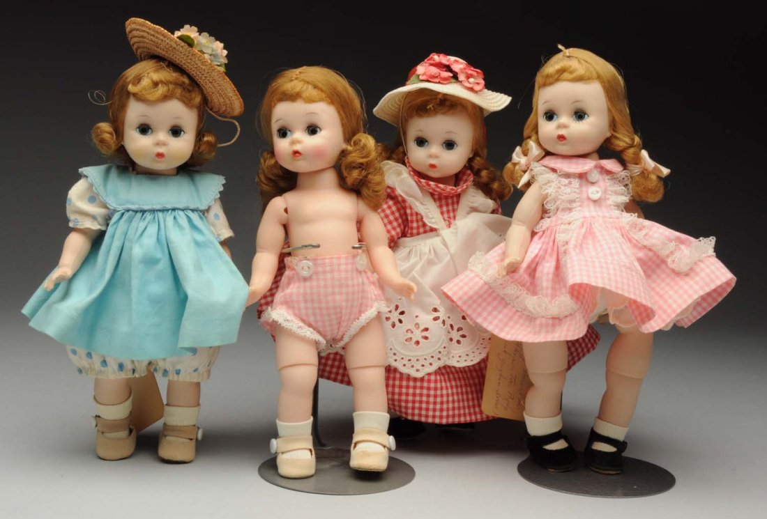 Lot of 4: Madame Alexander Dolls.: All hard plastic. “American Girl” bent-knee walker with original tagged clothing and unusual gold wrist tag; “Wendy” in blue tagged “Alexander-Kins” sunsuit and pinafore; “Wendy” with 