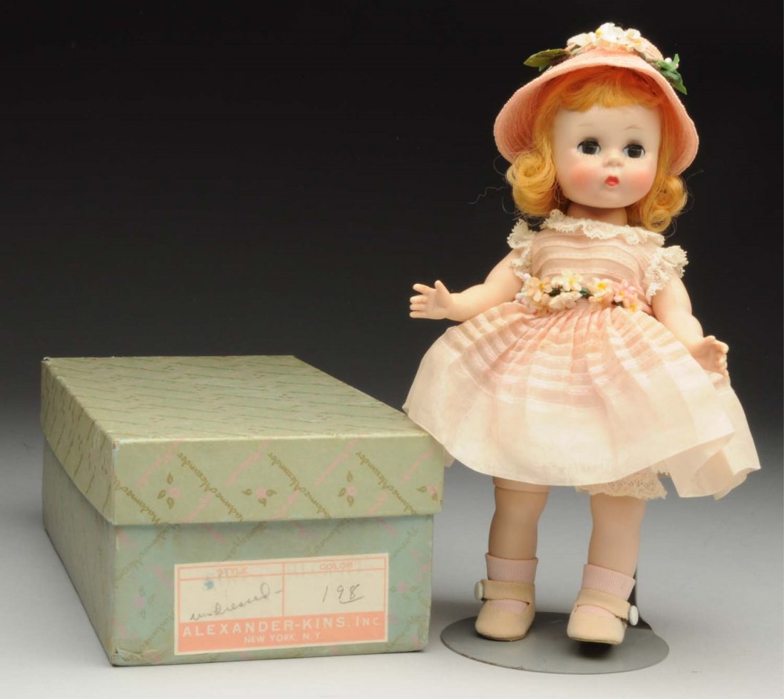 Alexander Hard Plastic “Wendy” Doll.: “Wendy Dressed for a Party” 1957 Bent-knee walker with original wig and sleeping eyes in original crisp party dress with straw bonnet in labeled Alexander box. Very rare model! Condition (Excellen