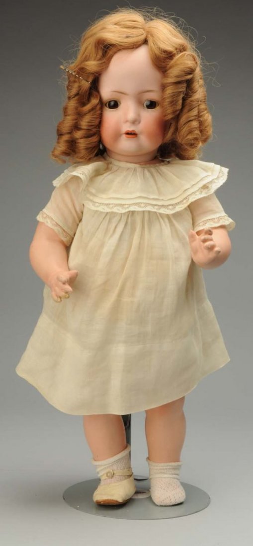 Delightful German BSW Character Toddler.: Bisque socket head incised BSW in Heart 2097 – 5” by Bruno Schmidt, with wavy multistroked eyebrows, sleeping eyes, open mouth with two upper teeth, replaced long curl wig; five-piece chubby toddl