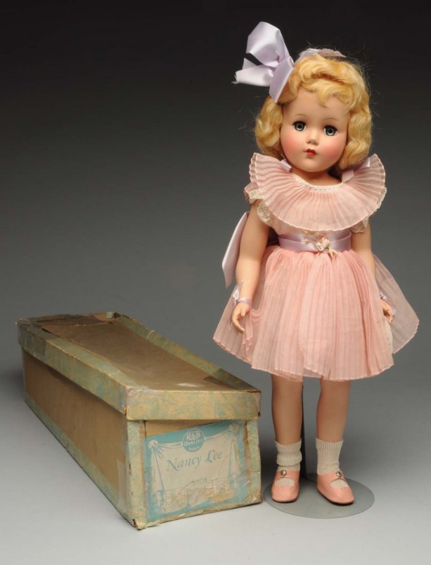 Arranbee Hard Plastic “Nancy Lee” Doll.: Original mohair wig in original set, lashed sleeping eyes, rosy cheeks, original crisp organdy outfit with wrist tag in original labeled box (box is worn and torn). Fabulous doll! Condition (Excellent