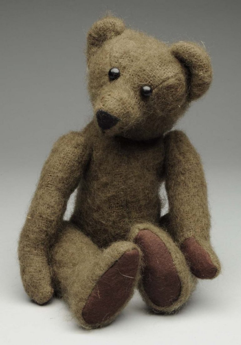 Plush Bear: Vintage pump back straw filled bear. Jointed hips and arms spotting mohair loss. Condition (Very Good - Excellent). Size 12" - L