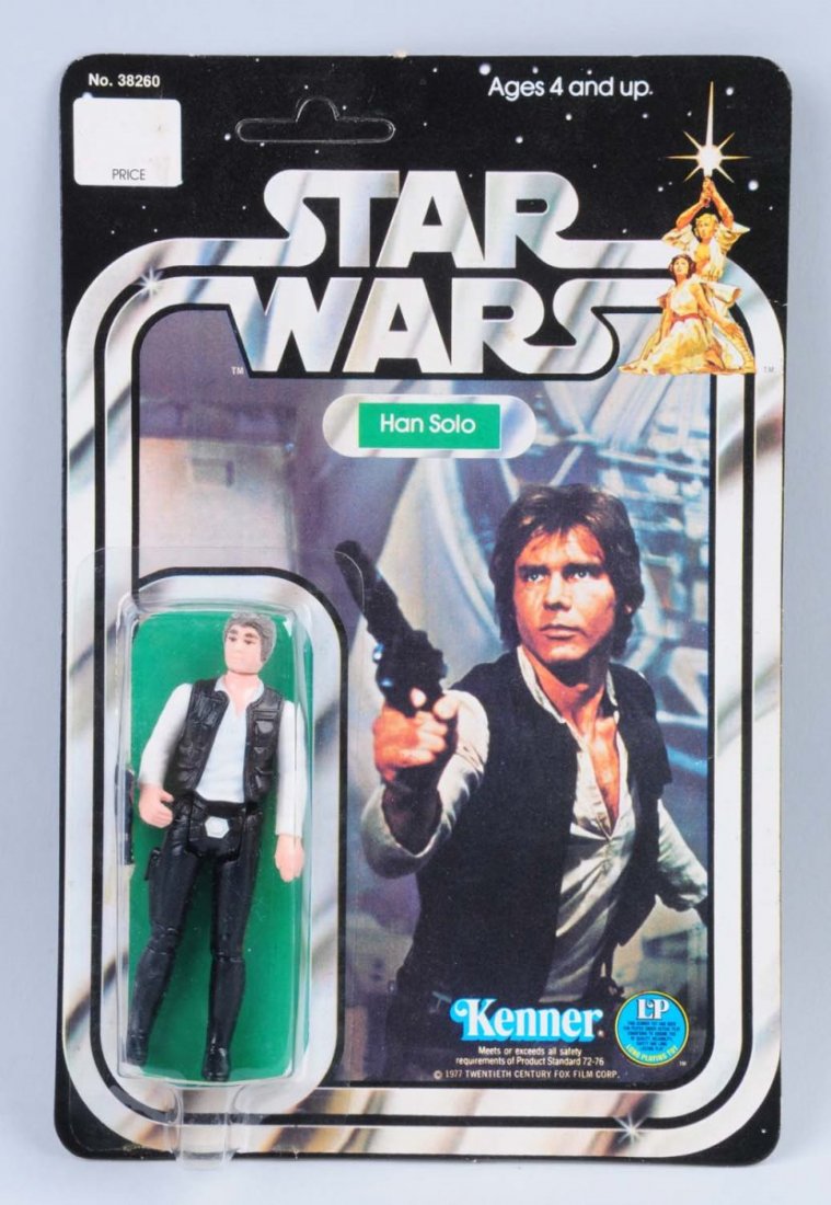 Star Wars Han Solo Carded Figure: Circa 1977, Kenner, Hong Kong. Unpunched. The figure and bubble are in pristine conditions, the figure is the 12-pack early edition. The card is flat and has great colorful graphics on both sides. Con