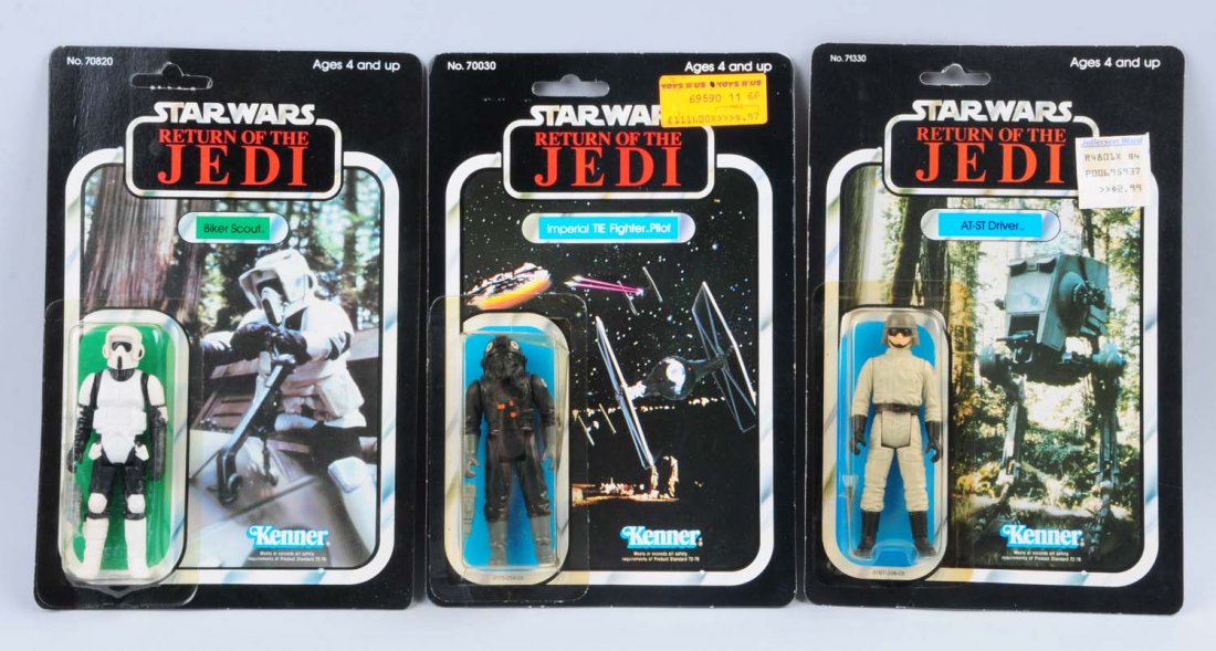 Lot of 3: Star Wars Carded Figures: Biker Scout, AT-ST Driver, and Imperial TIE Fighter Pilot. The Biker Scout figure is unpunched, and there is a slight paper bend on the left side of the card. The figure and bubble are in pristine con
