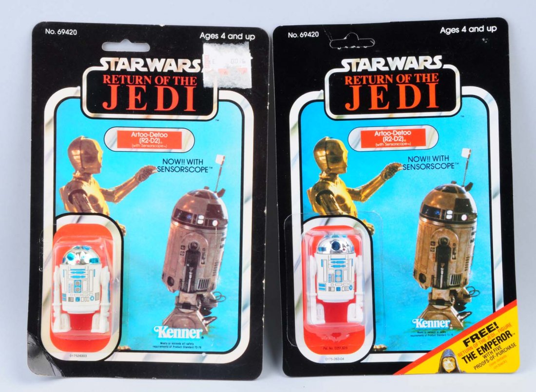 Lot of 2: Star Wars Artoo-Detoo Carded Figures.: Circa 1983, Kenner, Hong Kong. One punched, and one Unpunched. Both figures are the version with the sensorscope. One card has the original price tag attached on the upper left hand corner, and it is 