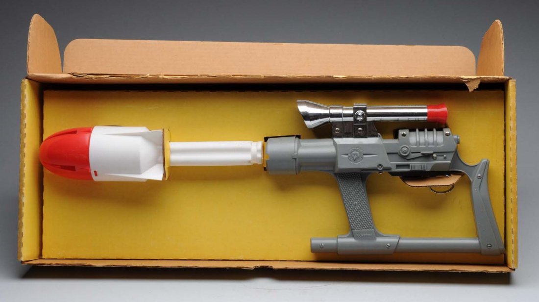 "The Red Fox Missile".: Made by Hubley. Plastic gun with missile attachment. Gun appears to be in almost unused condition. Includes laser aim on top of the gun. Also includes original box. Condition (Excellent - Near Mint). 