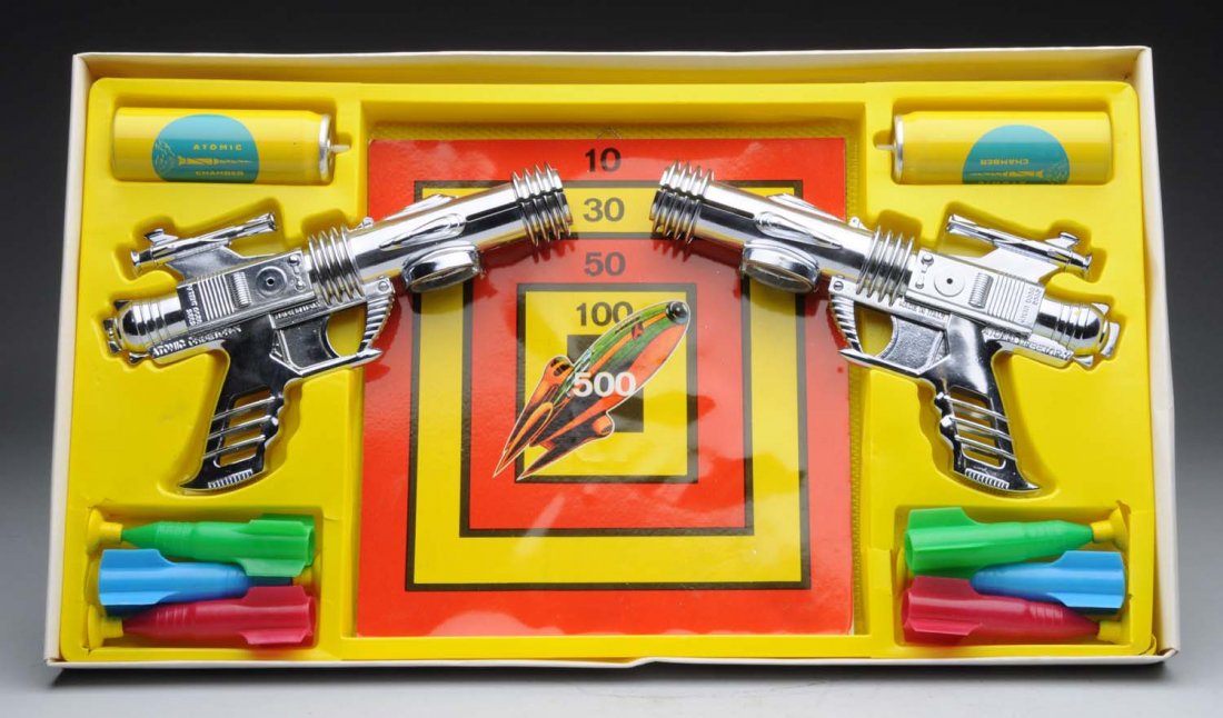 Atomic Orbetor-X Space Game.: Has two plastic guns, a little rockets attached and two canisters. Appears to be unplayed with and unopened. Comes with original box; has plastic inserts. Condition (Excellent - Near Mint). Size 20" x