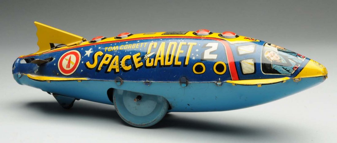 Marx Tin Litho Wind-Up Tom Corbett Space Cadet.: Marked "Rockhill Productions." Has replacement tail, and needs flint to spark. Nice lithography, with some minor litho loss and some scratching underneath. Condition (Very Good - Excellent). Size 12 -