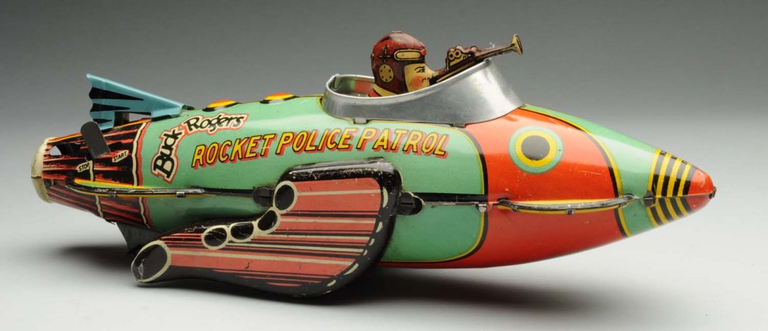 Marx Wind-Up Buck Rogers Rocket Police Patrol Toy: Toy has a replacement tail fin, and some bending to the gun in front. One scuff mark of litho loss underneath the rocket ship. General overall scratching and wear. Condition (Very Good). Size 12" L.