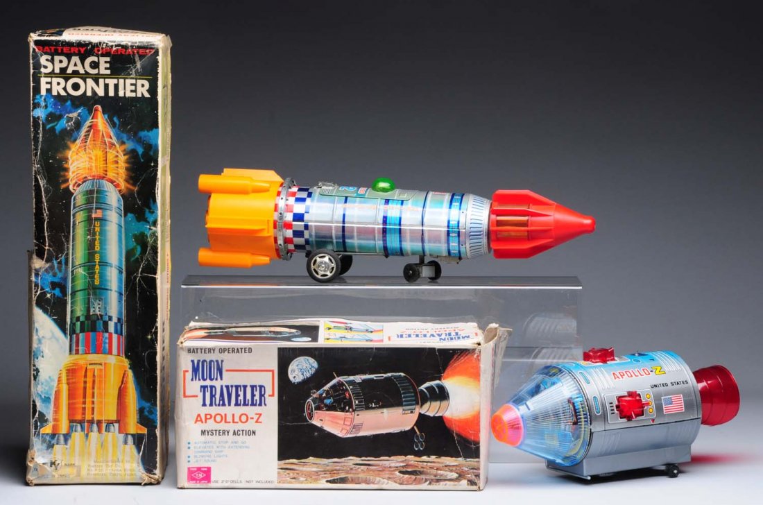 Lot of 2: Japanese Battery Operated Space Rockets: Includes original boxes. Boxes have some creasing and wear. One is a moon traveler Apollo-Z, and the other is a space frontier US missile. Condition (Very Good - Excellent). Size Largest: 19" L.