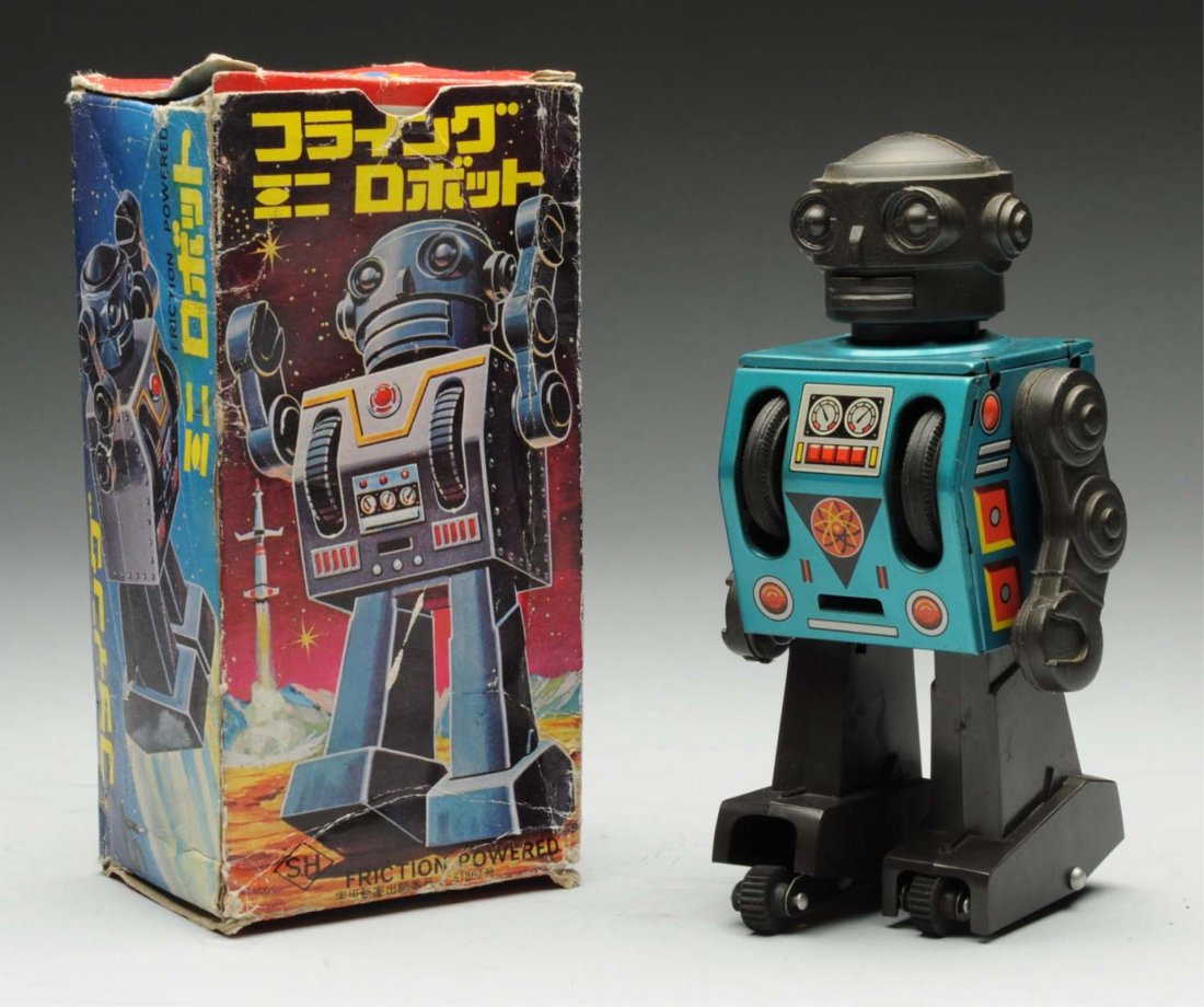 Tin Litho & Plastic Friction Rusher Robot.: Version of this robot was sold in Japan for the Japanese market. Made by Horikawa. Working. Includes original box with some creasing and tear repairs. Condition Toy (Near Mint) Box (Very Good). Size 6